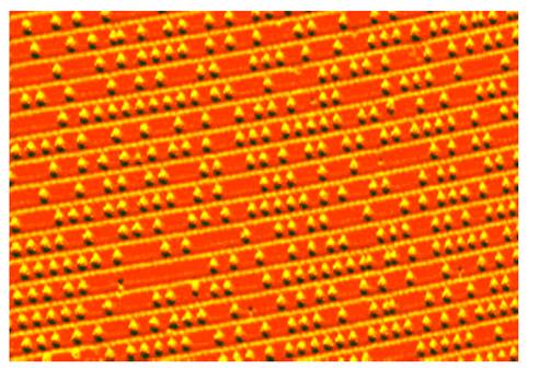 Scattering gold atoms on to silicon wafer